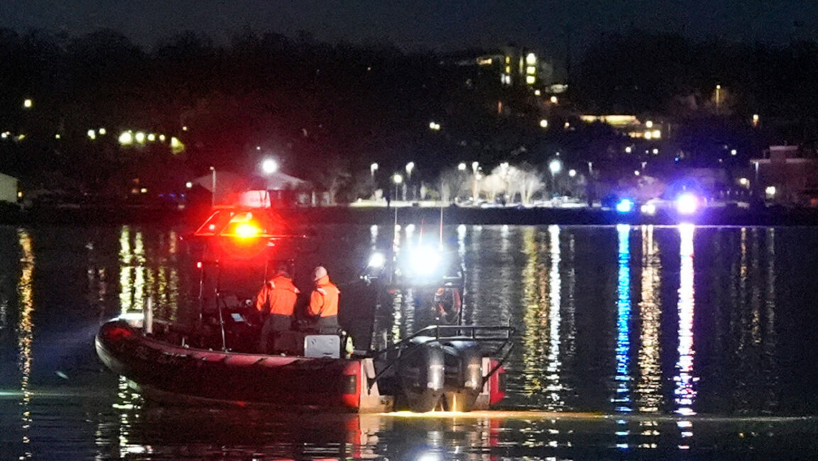 A boat processes the scene of the incident near Ronald Reagan National Airport, January 30, 2025
