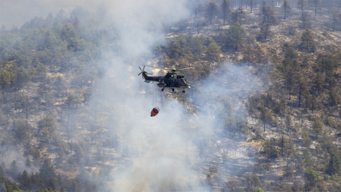 Air Force helicopters are assisting in extinguishing the wildfire