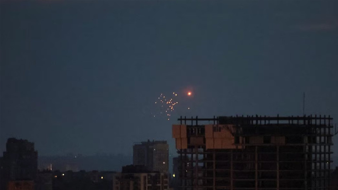 An explosion of a drone is seen in the sky over the city during a Russian drone strike, amid Russia's attack on Ukraine, in Kyiv, Ukraine June 20, 2023