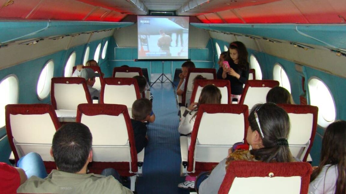 Screening of a science documentary on an aviation theme in front of museum visitors