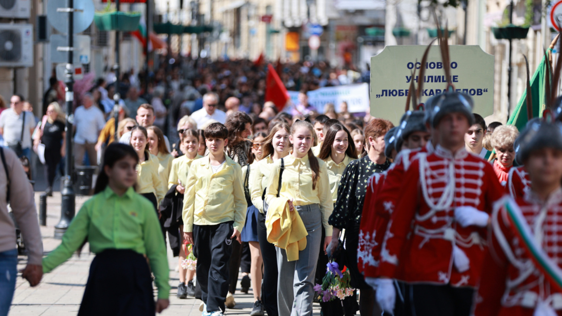 Participants march in a May 24 procession in Ruse.