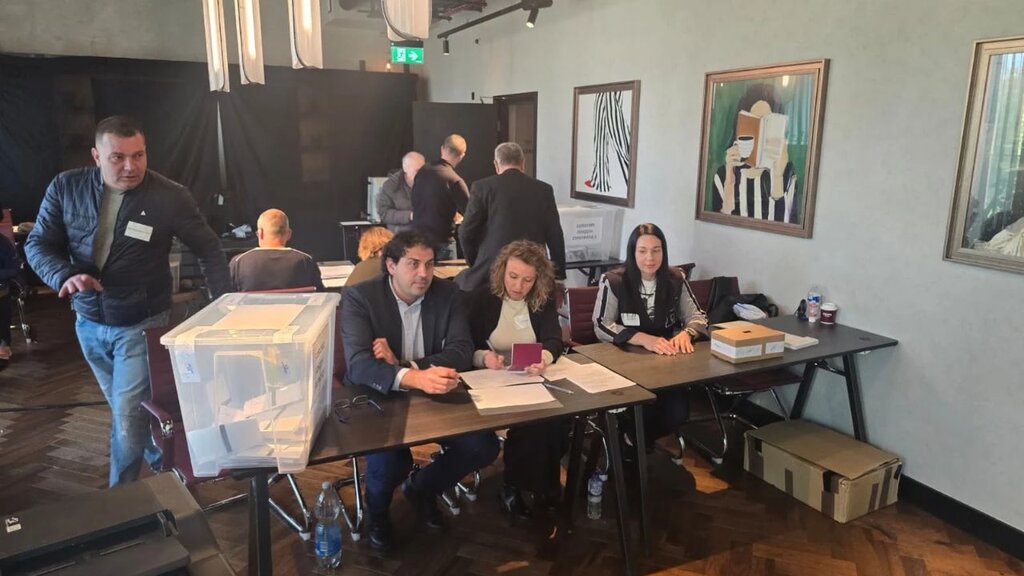 Alexander Bogdanov (standing on the left) – Stratford Election Commission, East London.