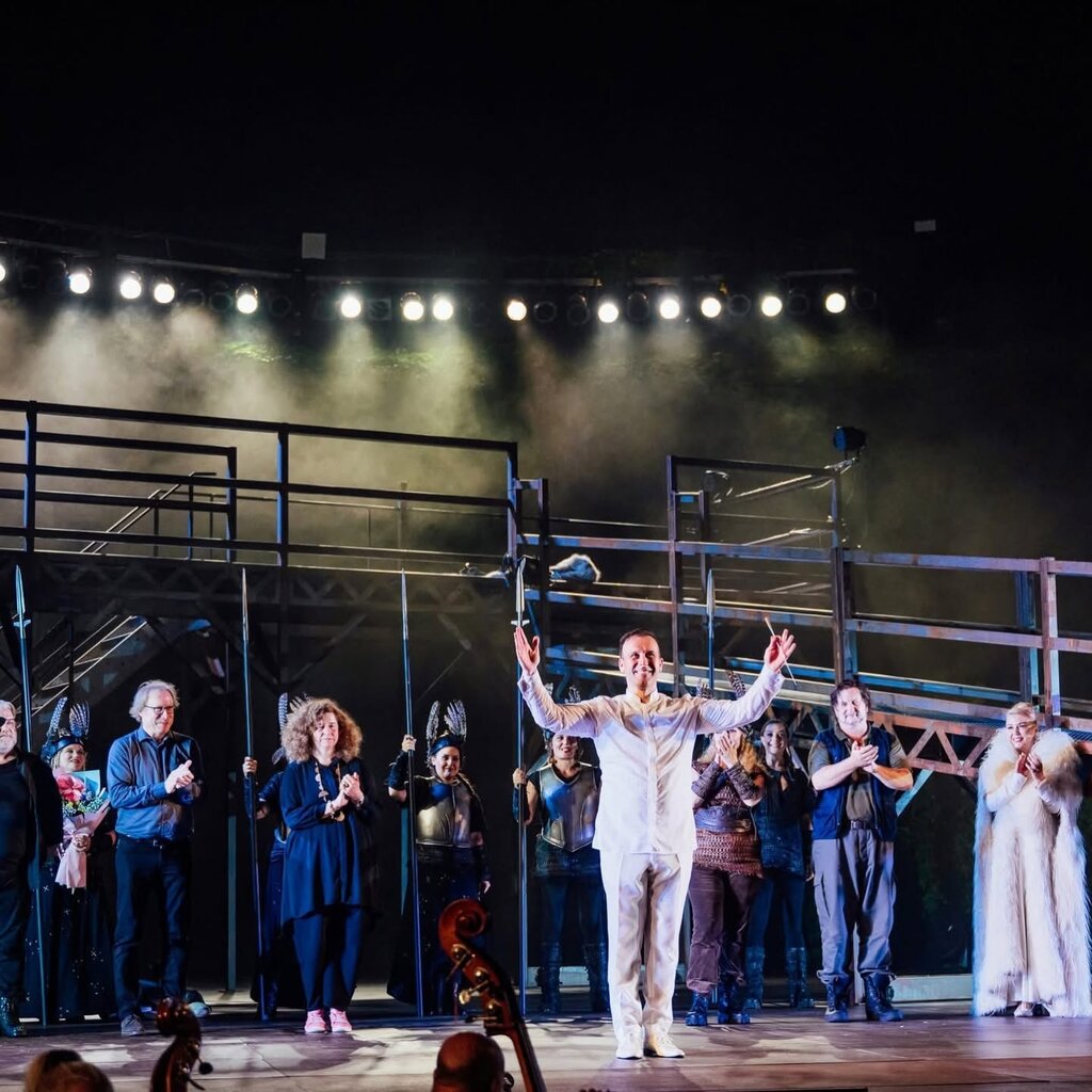 Svetoslav Borisov takes his curtain call after the Wagner Gala in Varna. Director Vera Nemirova is on stage (back left).